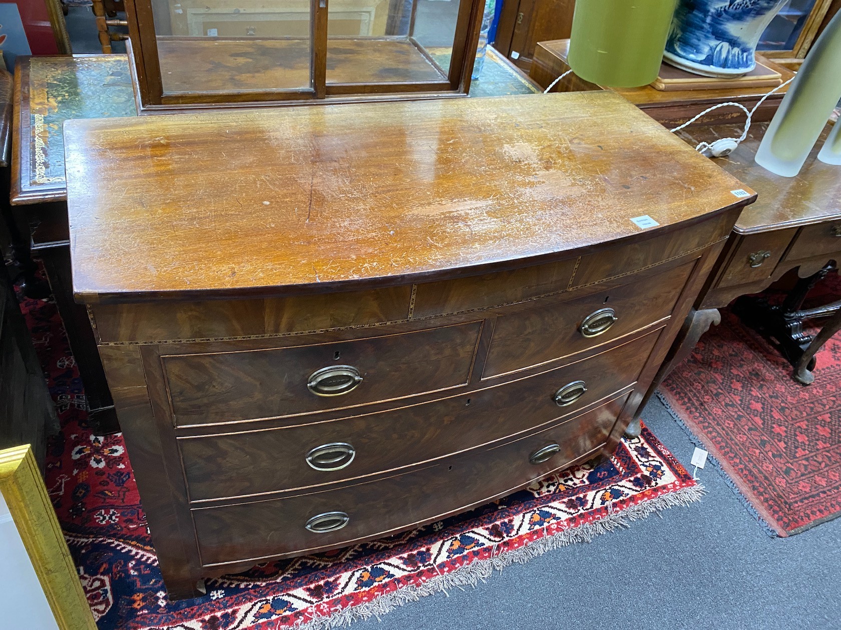 A George IV mahogany bow front chest, of two short and two long drawers incorporating a secret drawer, width 119cm, depth 55cm, height 87cm